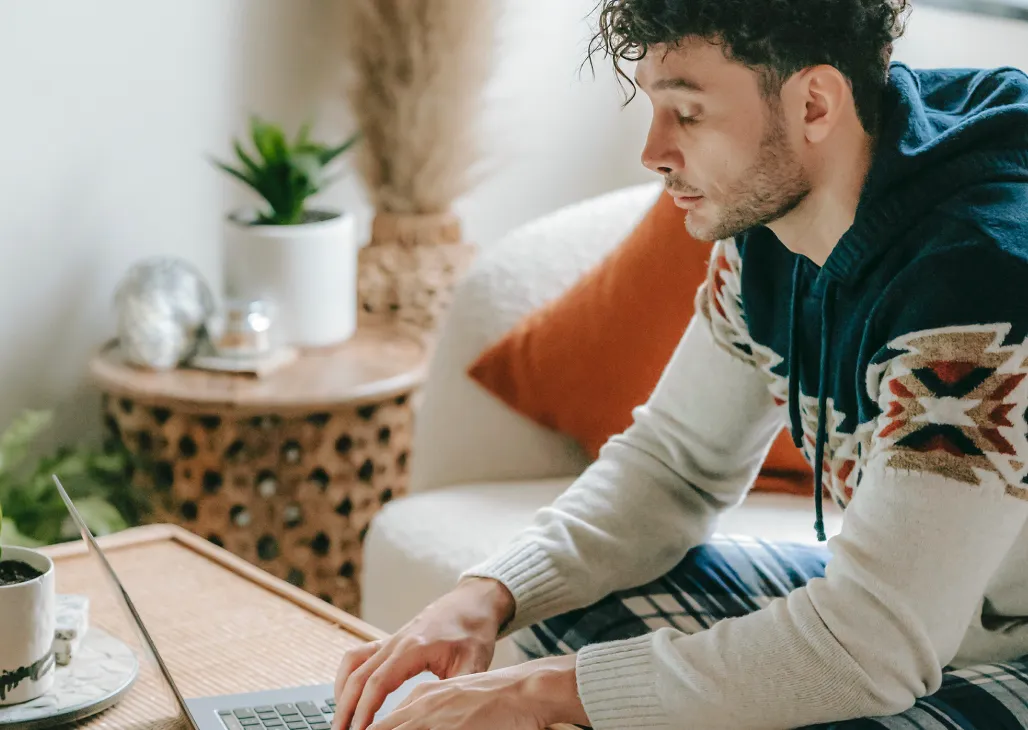 A Zowie employee leaning over his computer